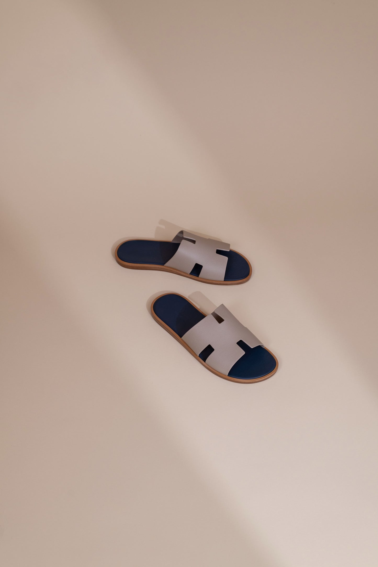 Hermès Izmir Sandals in Blanc Gomme/Bleu Celeste