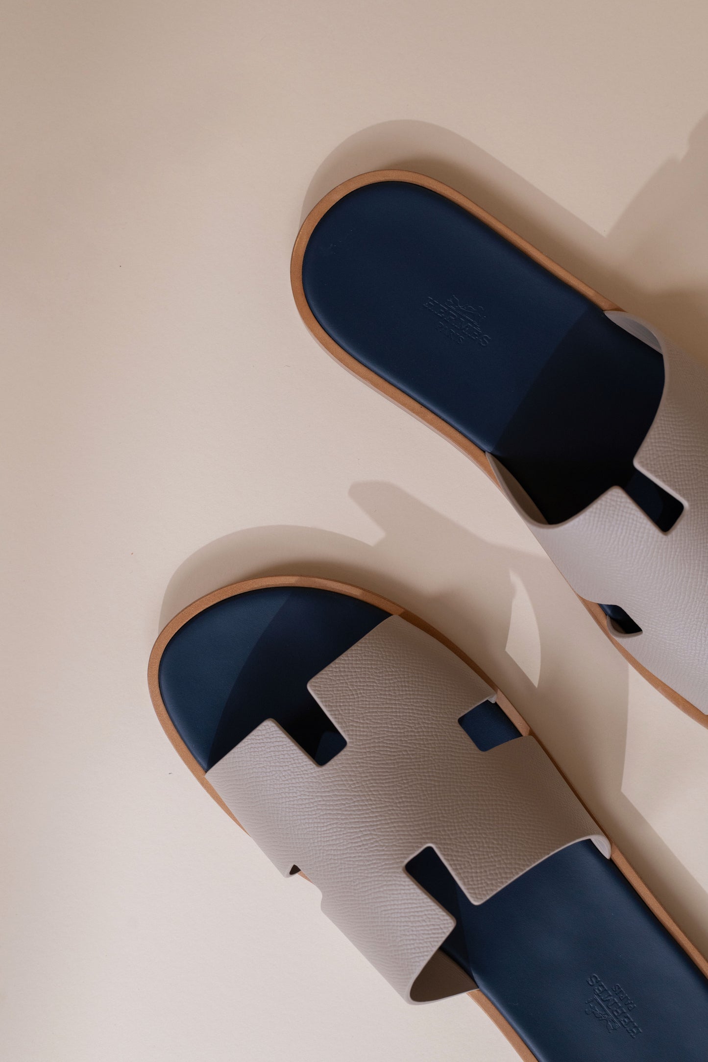 Hermès Izmir Sandals in Blanc Gomme/Bleu Celeste