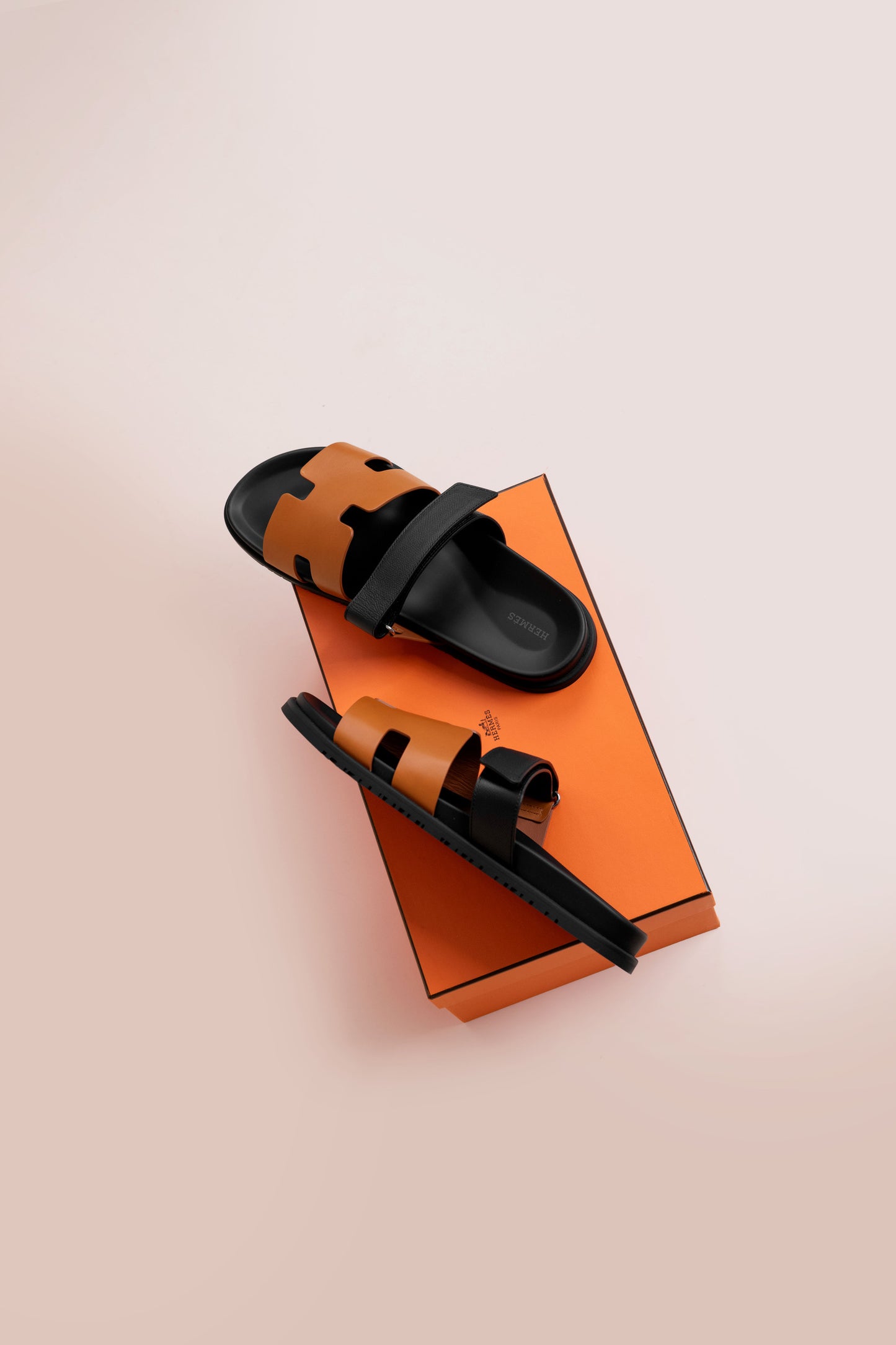 Hermès Chypre Sandals in Gold/Black