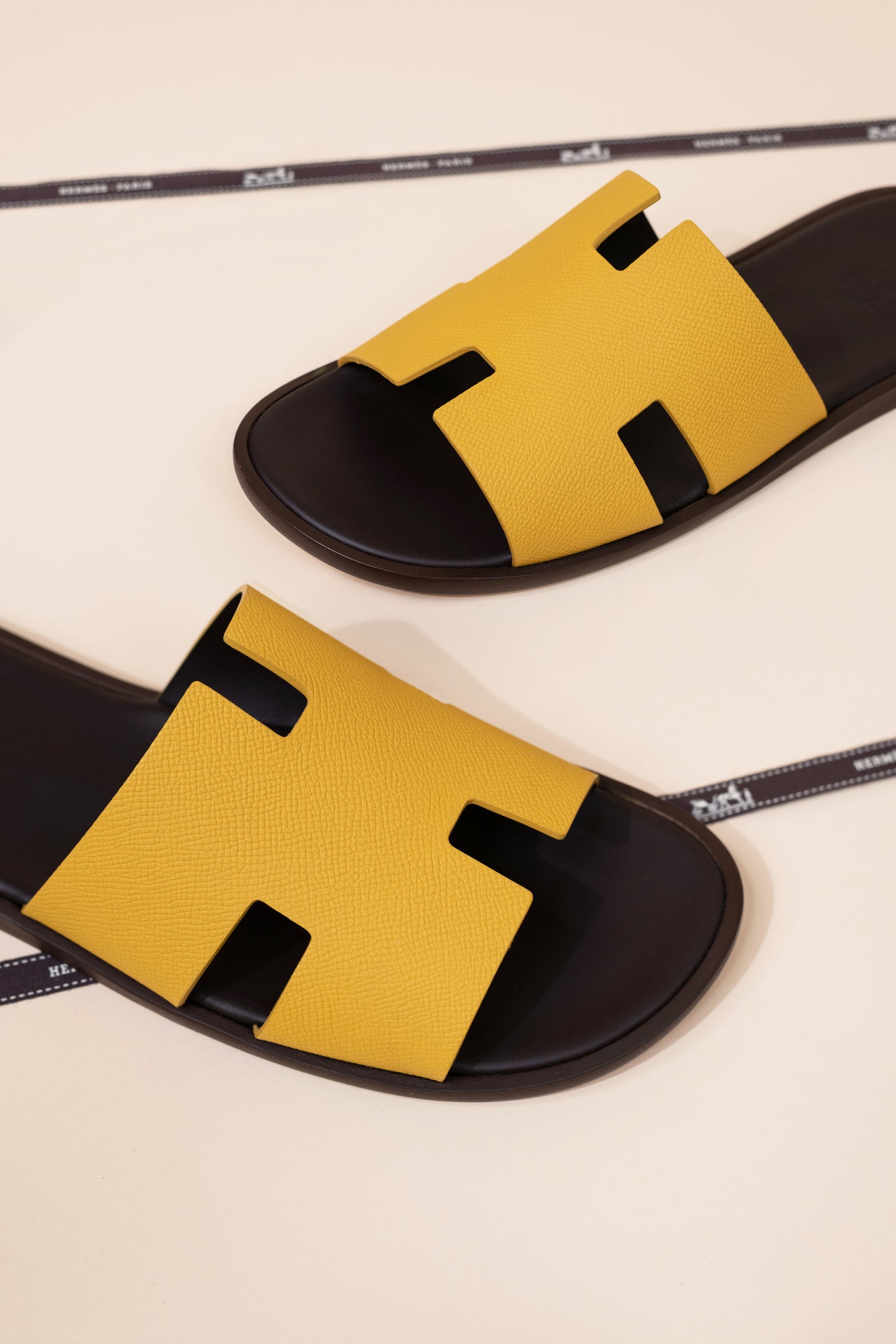 Hermès - Izmir Sandals in Jaune Ambre