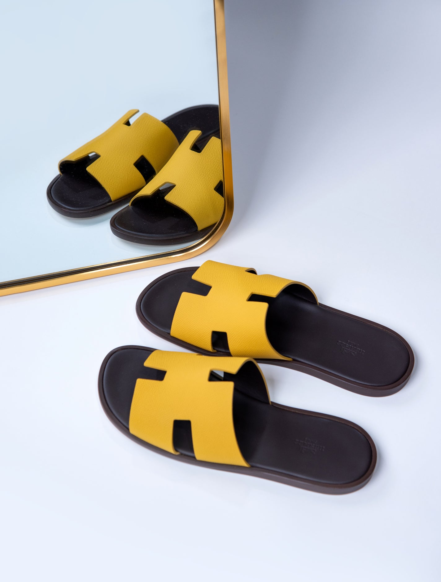 Hermès - Izmir Sandals in Jaune Ambre