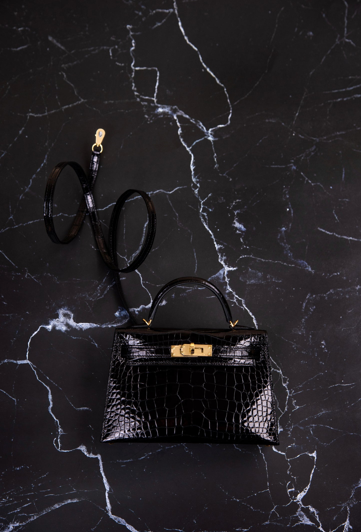 Hermès Mini Kelly Shiny Crocodile in Black GHW