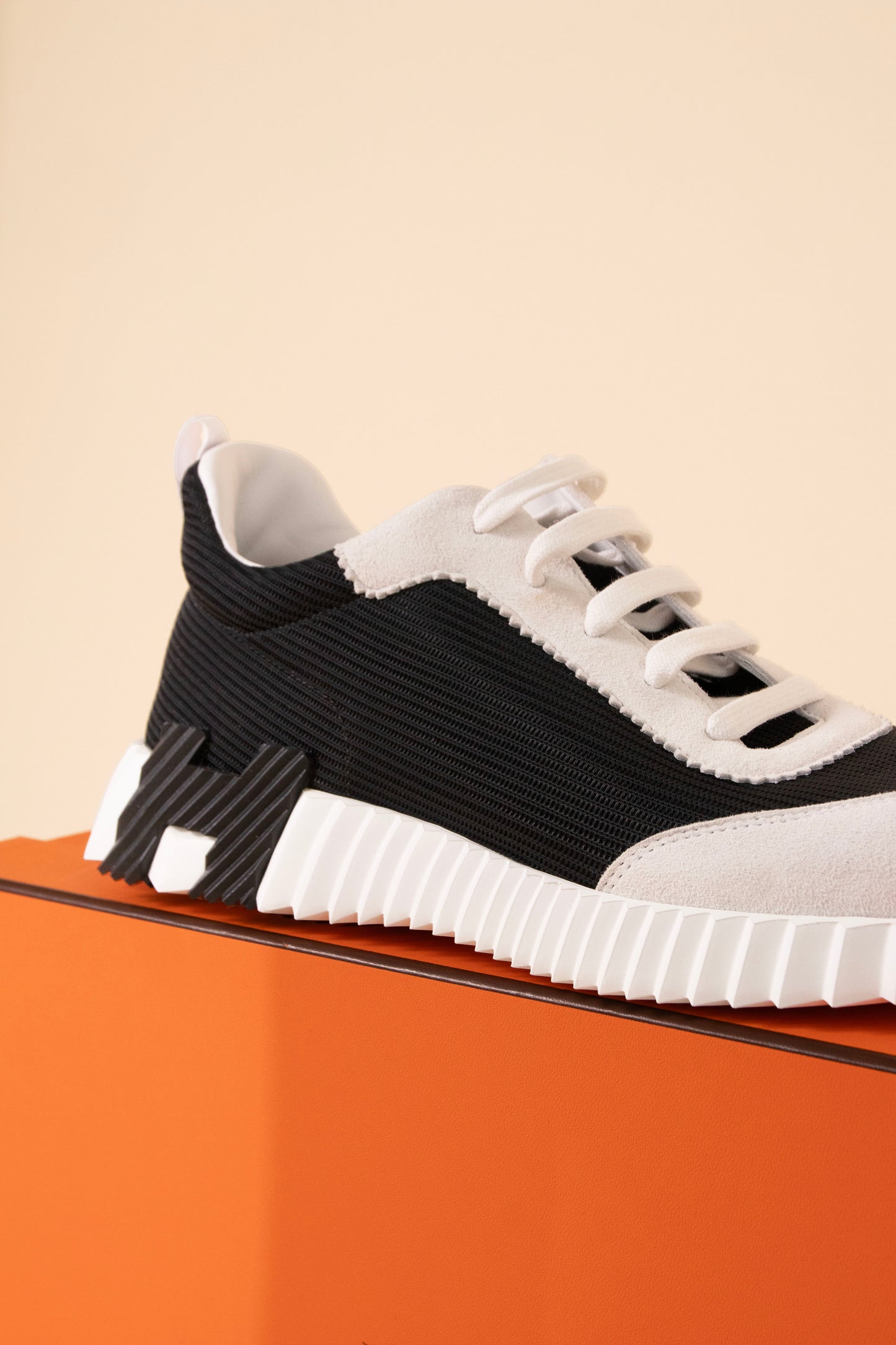 Hermès Bouncing Sneakers in White/Black