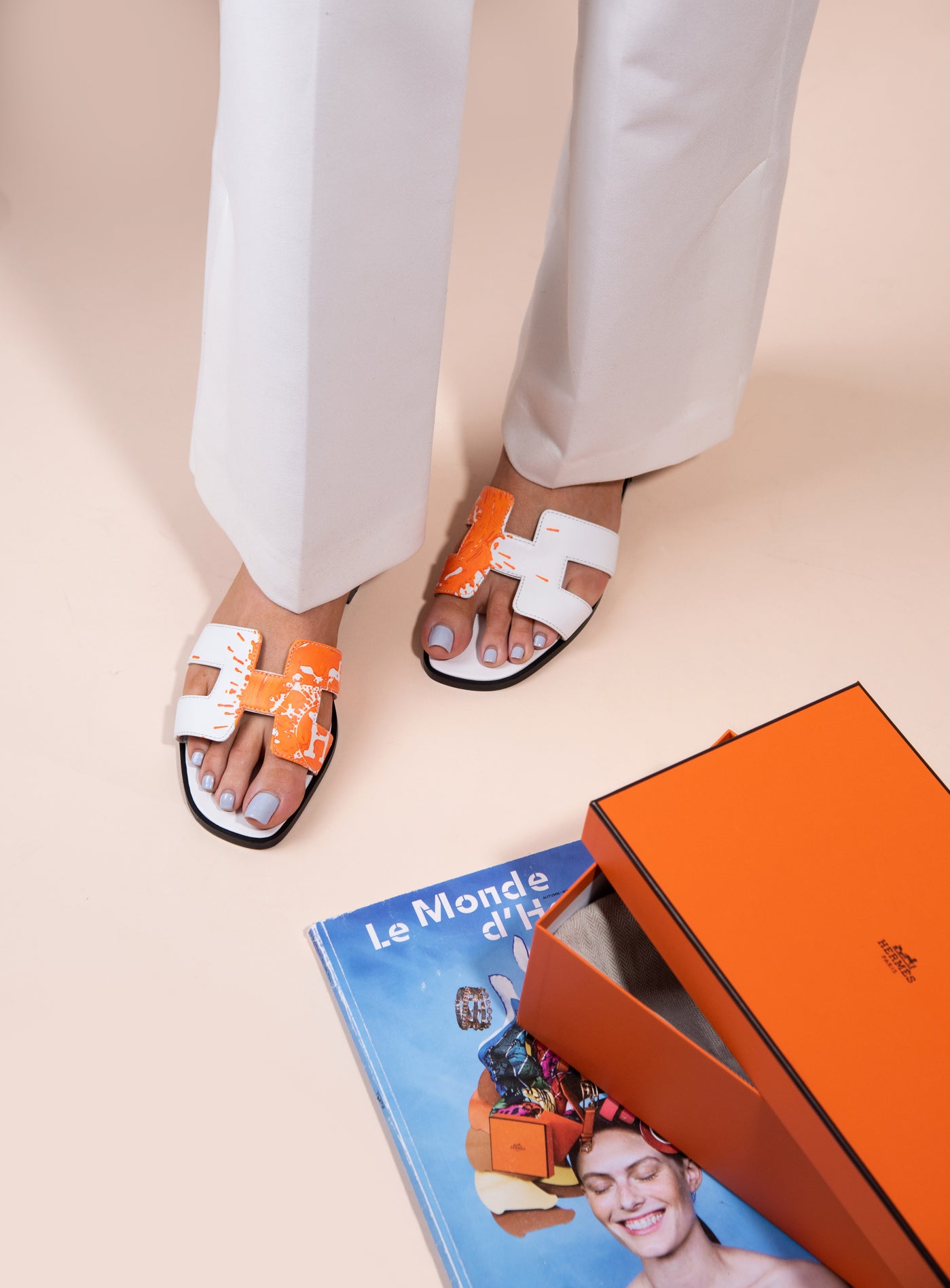 Hermès Oran Sandals in White/Orange Splash