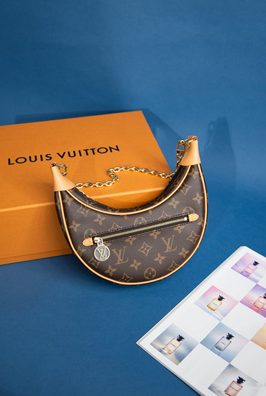 حقيبة لويس فيتون لوب بنية اللون من القماش المغلف