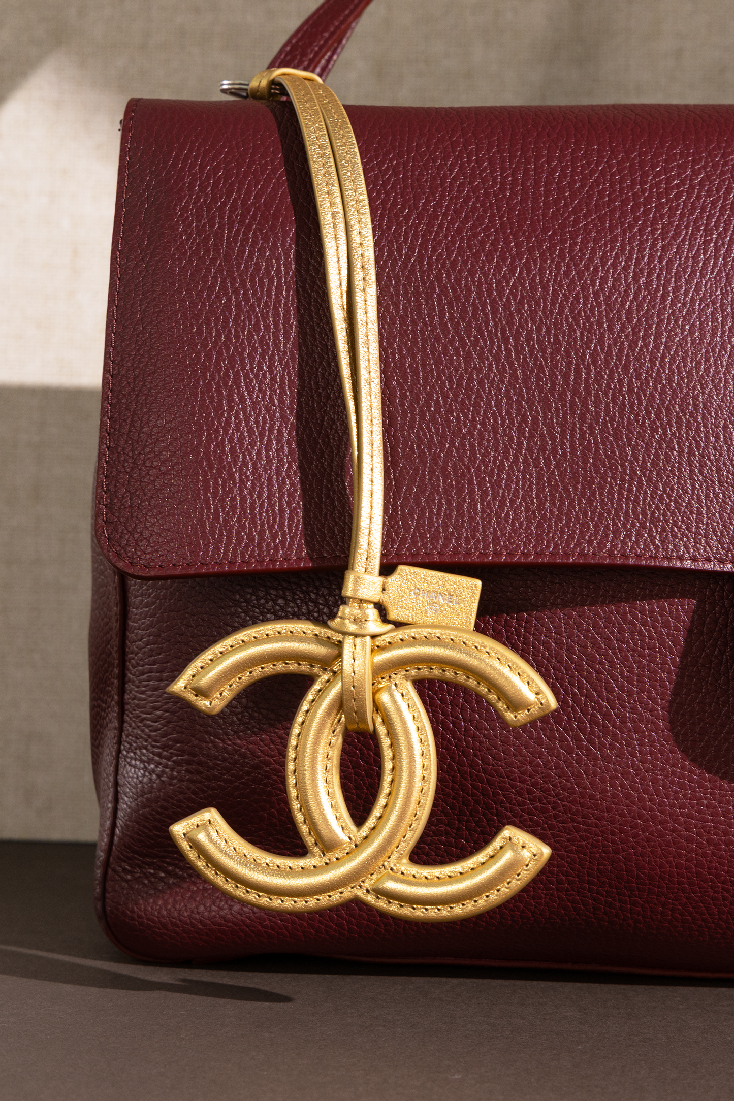 Chanel Maxi Flap Bag in Burgundy with Gold CC Charm