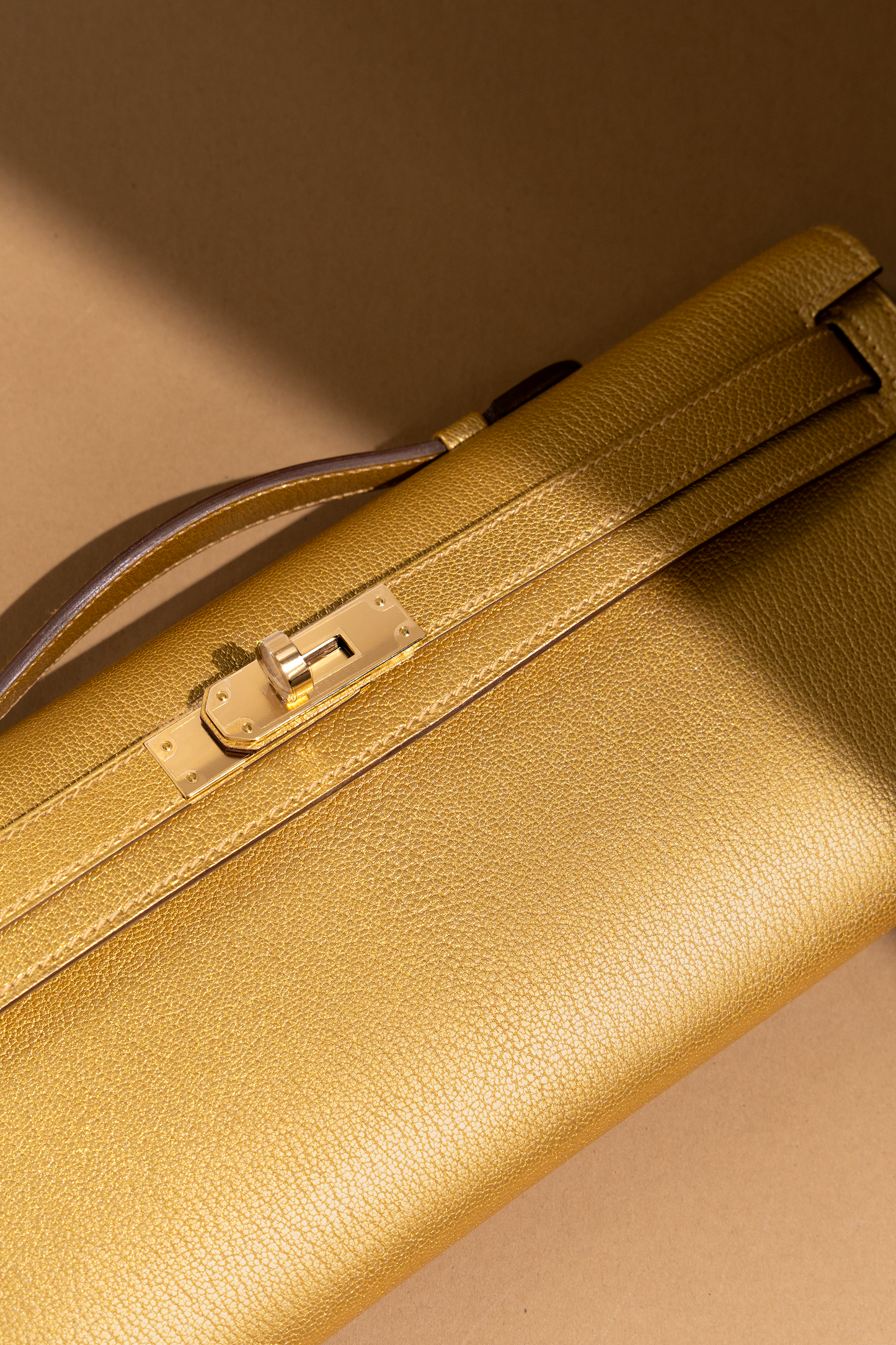 Hermès Kelly Cut Clutch in Chamkilight Dore GHW