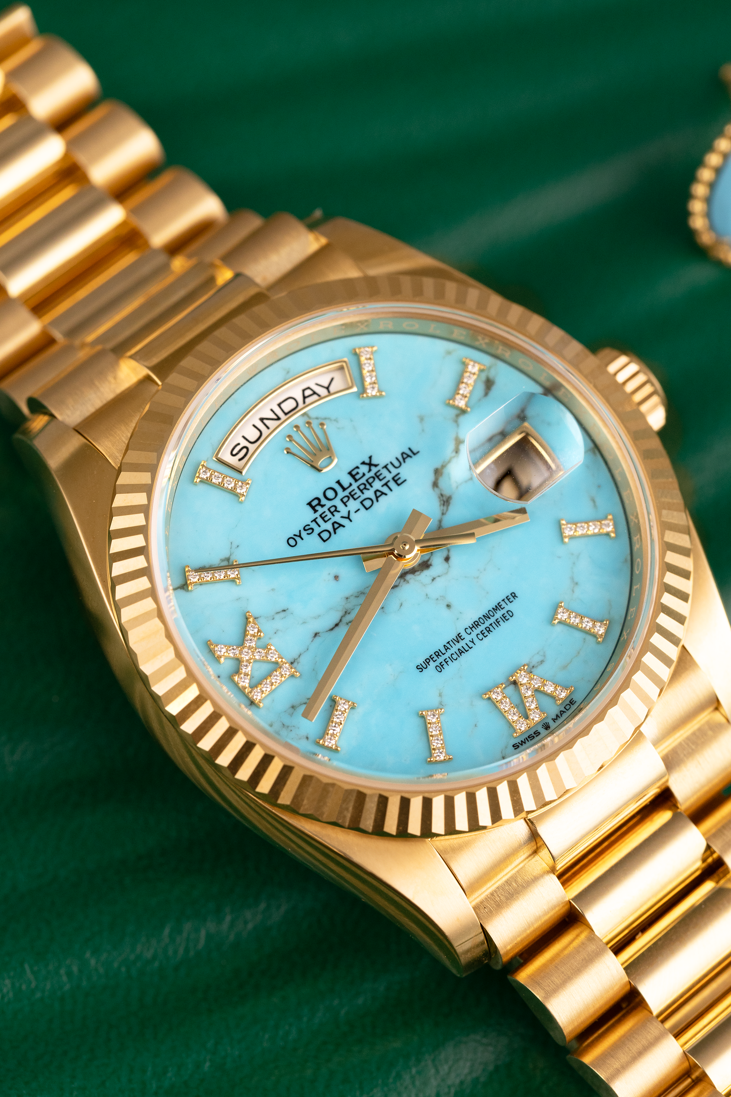 Rolex Day Date 36mm in Yellow Gold with Turquoise Dial & Boucheron Serpent Boheme Stud Earrings