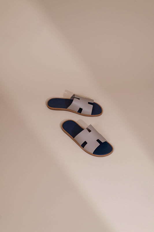 Hermès Izmir Sandals in Blanc Gomme/Bleu Celeste