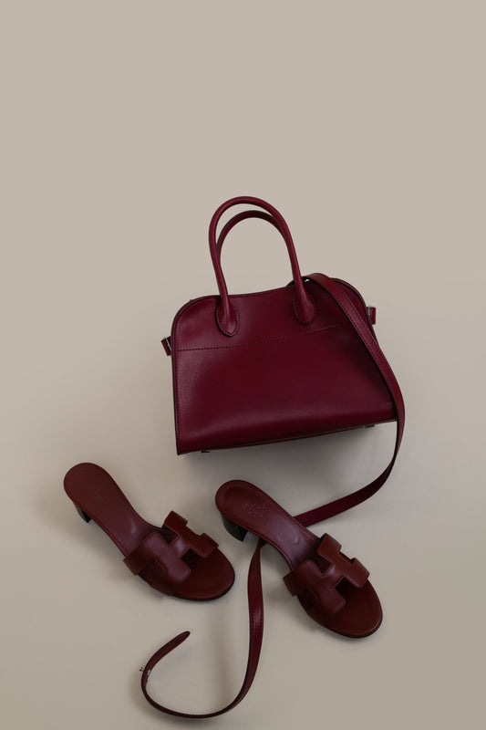 The Row The Margaux Burgundy Bag & Hermès Burgundy Oasis Sandals
