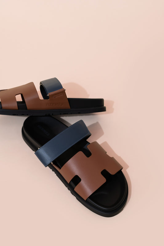 Hermès Chypre Sandals in Gold/Navy