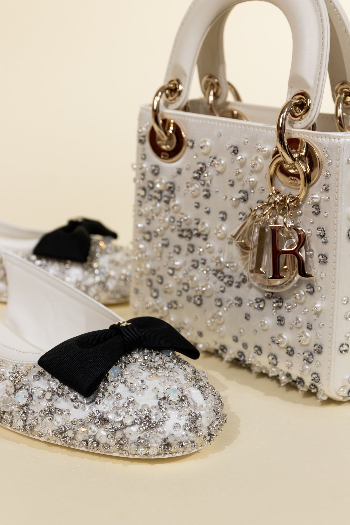 Dior Mini Lady Dior Bag in Latte Satin Embroidered with Beads & Chanel White/Black Bow Beaded Flats