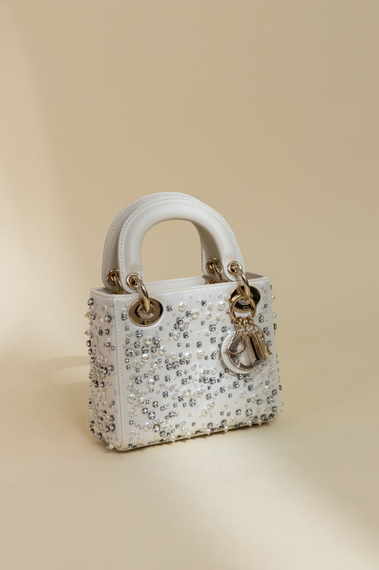 Dior Mini Lady Dior Bag in Latte Satin Embroidered with Beads & Chanel White/Black Bow Beaded Flats
