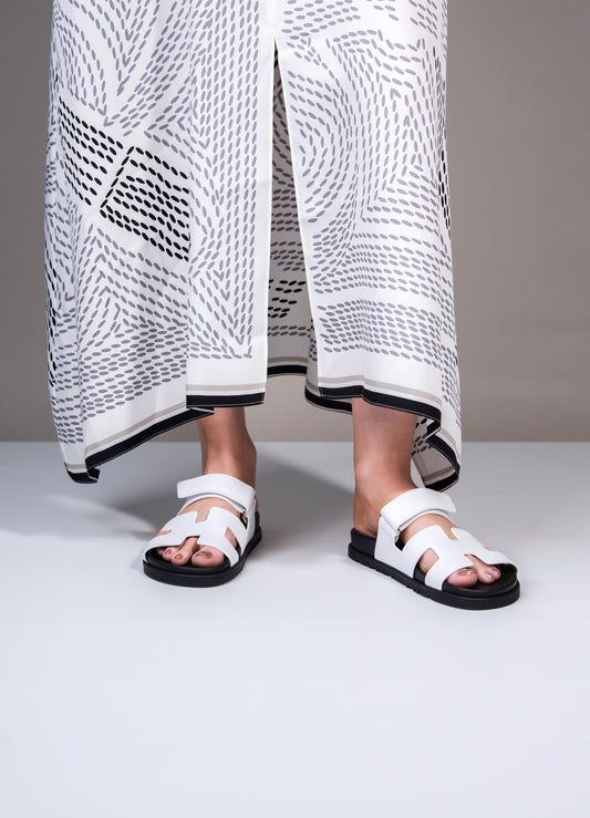 Hermès - Chypre Sandals in White/Black