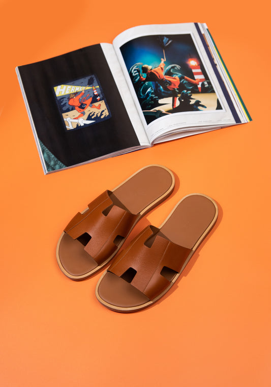 Hermès Izmir Sandals in Gold