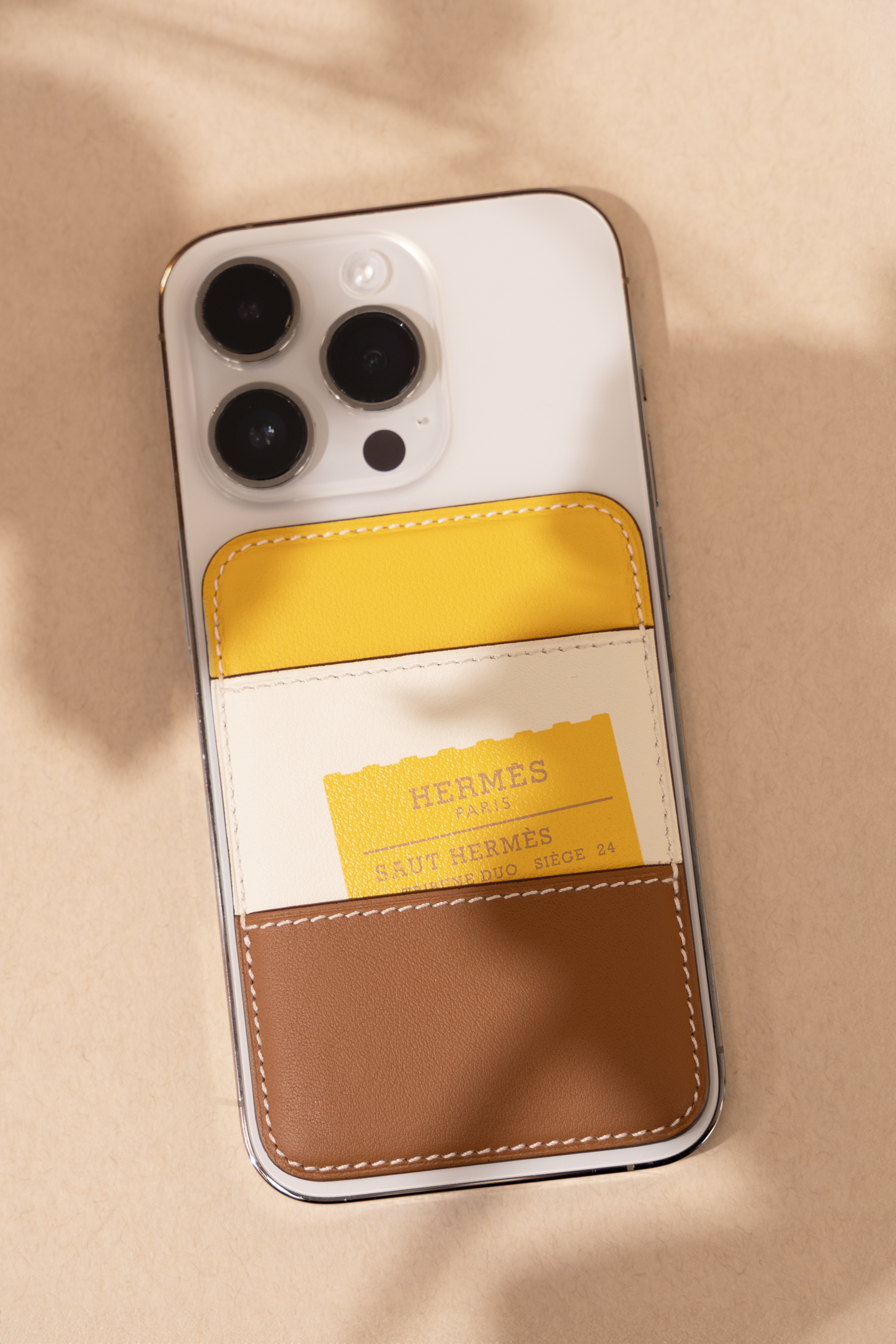 Hermès "Saut Hermès" Magsafe Card Holder in Gold/Nata/Sun/Chaï