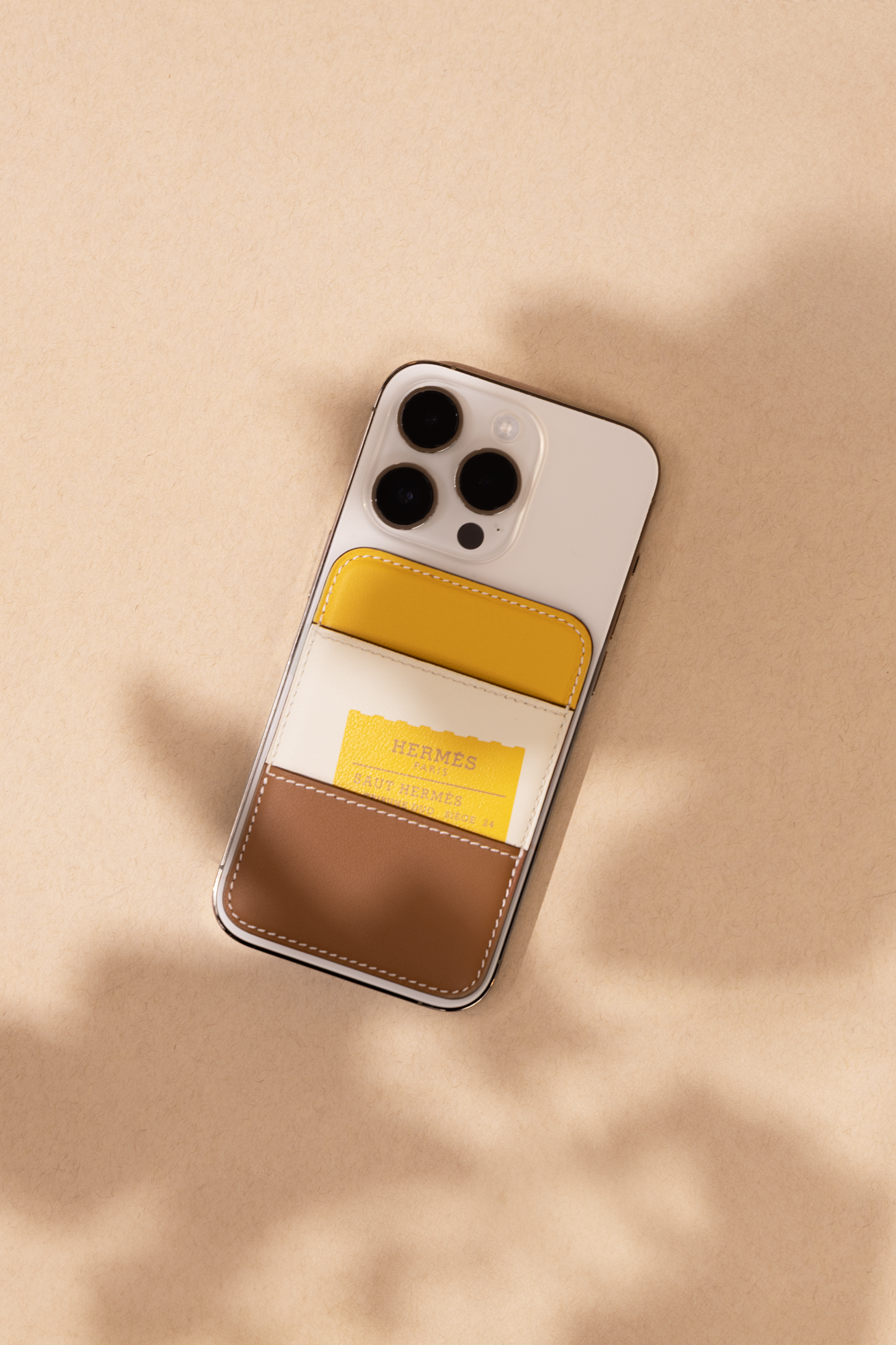 Hermès "Saut Hermès" Magsafe Card Holder in Gold/Nata/Sun/Chaï