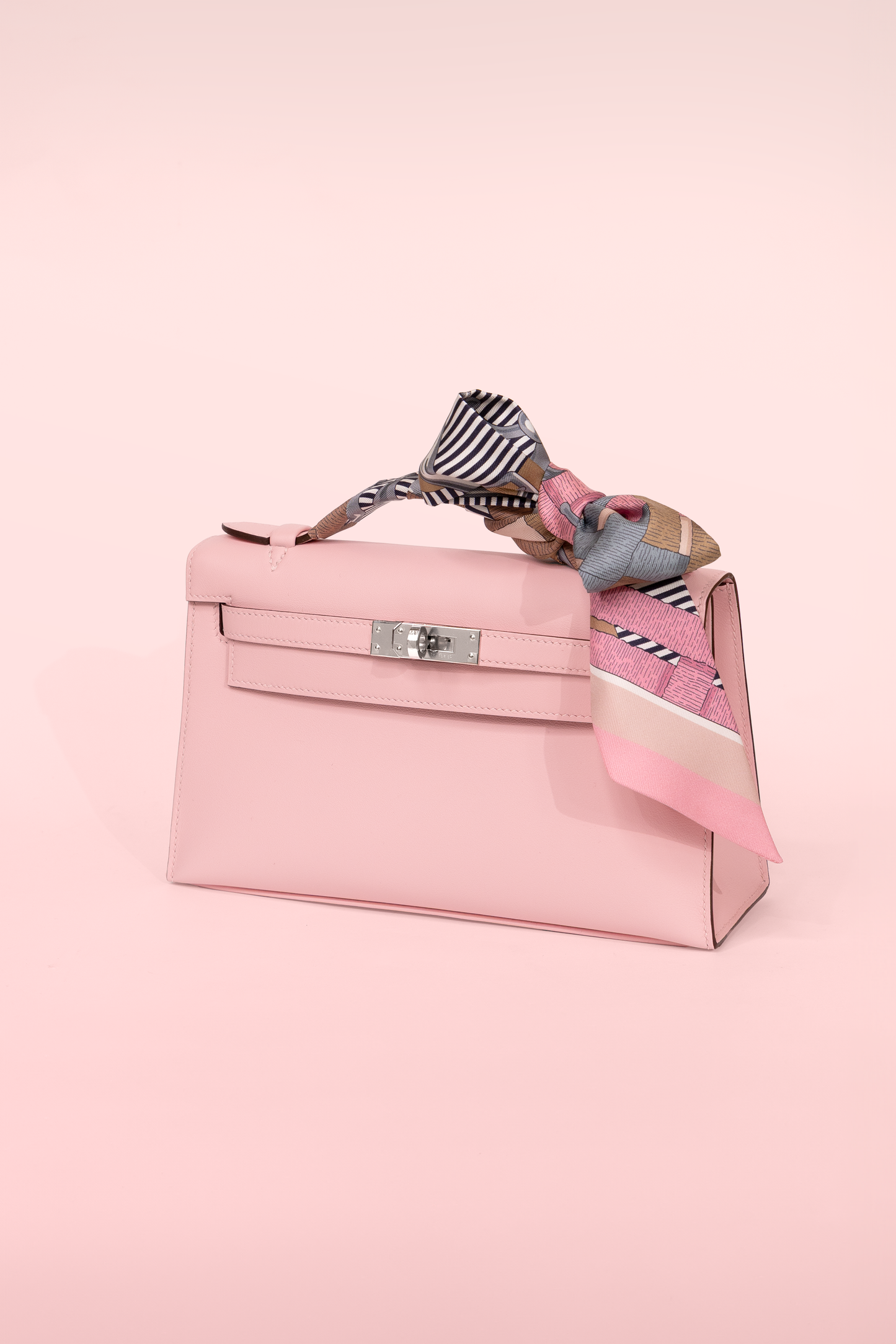 Hermès Kelly Pochette Swift in Rose Sakura PHW