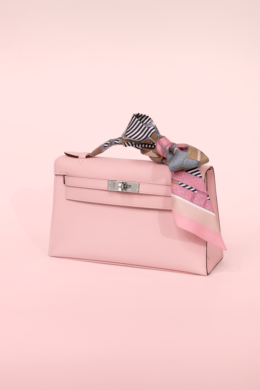 Hermès Kelly Pochette Swift in Rose Sakura PHW