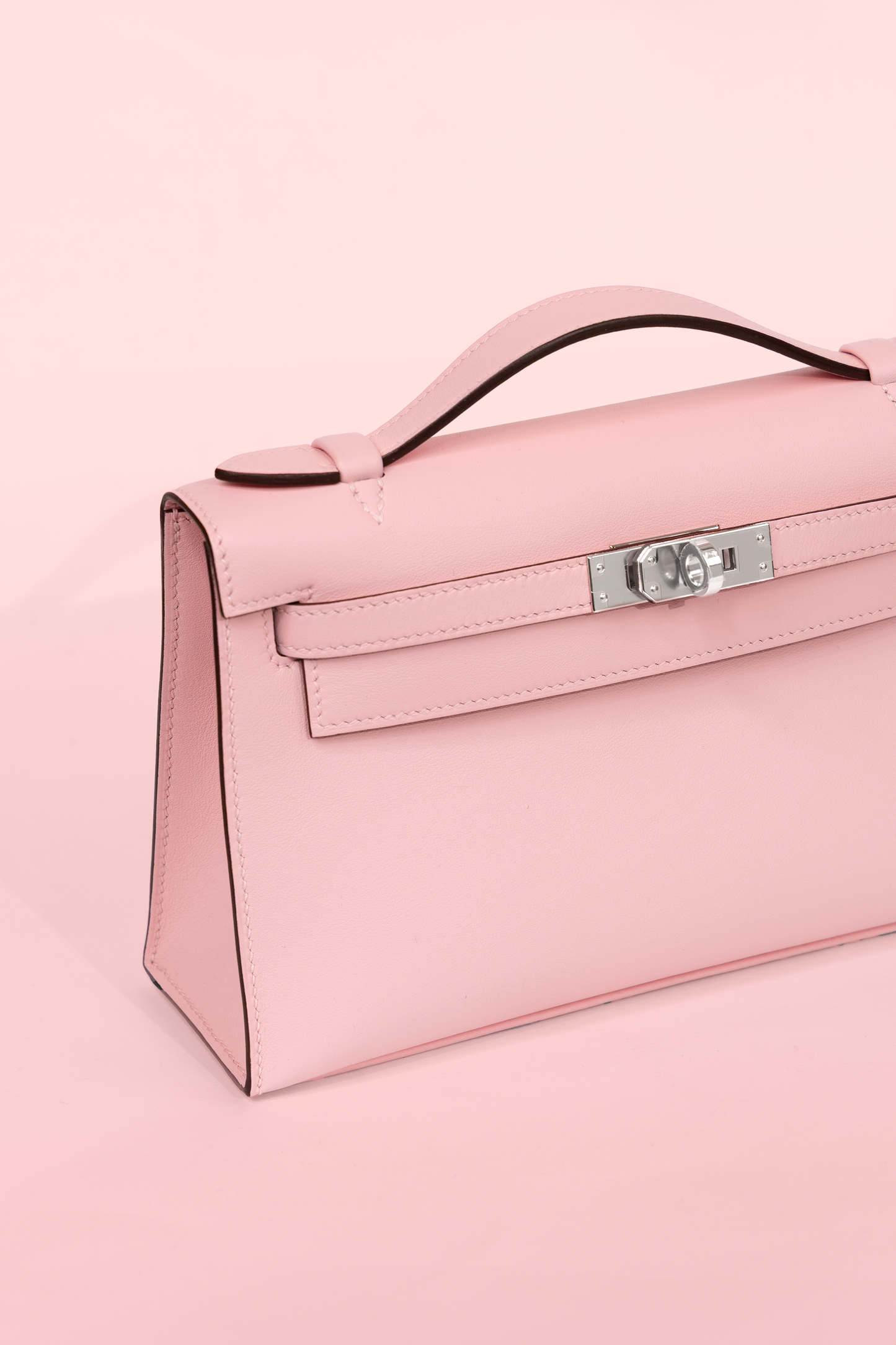 Hermès Kelly Pochette Swift in Rose Sakura PHW