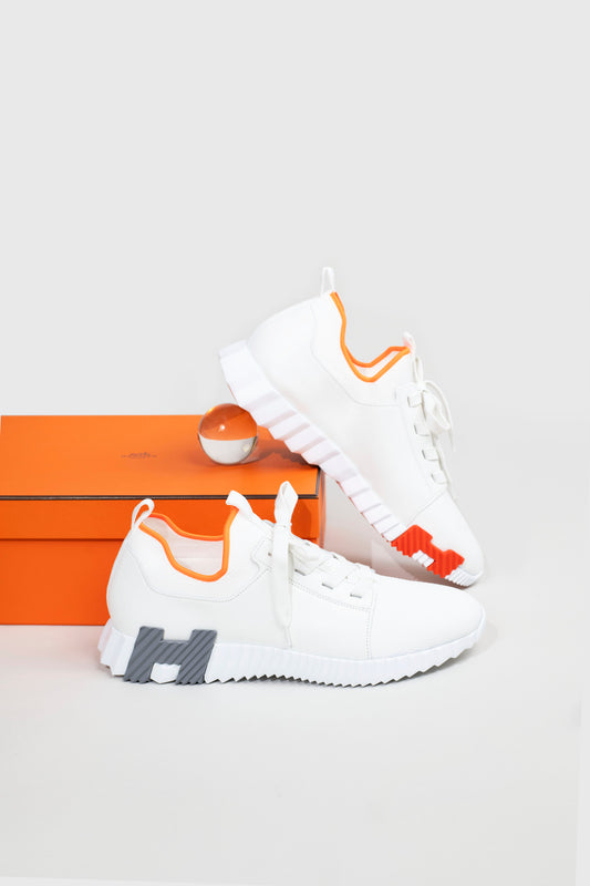 Hermès Depart Sneakers in White/Orange