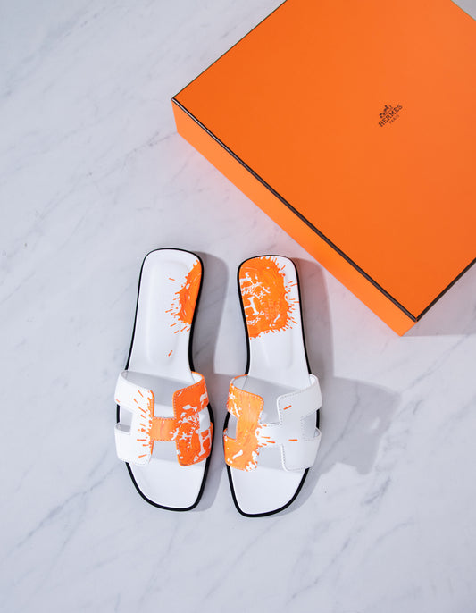Hermès Oran Sandals in White/Orange Splash