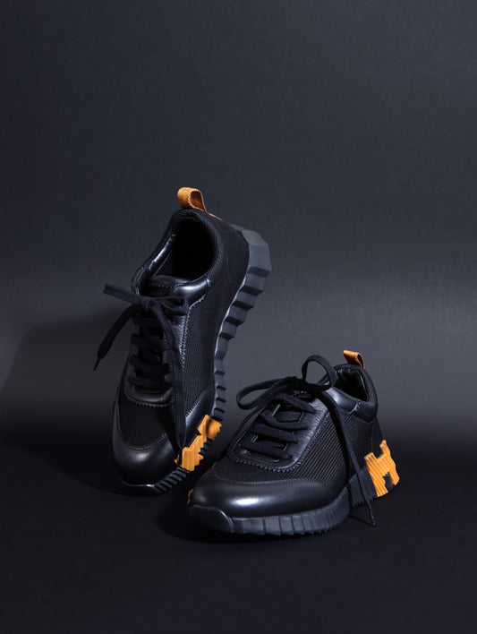 Hermès Bouncing Sneakers in Black & Gold