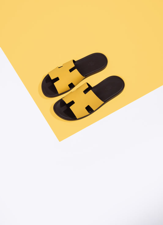 Hermès - Izmir Sandals in Jaune Ambre