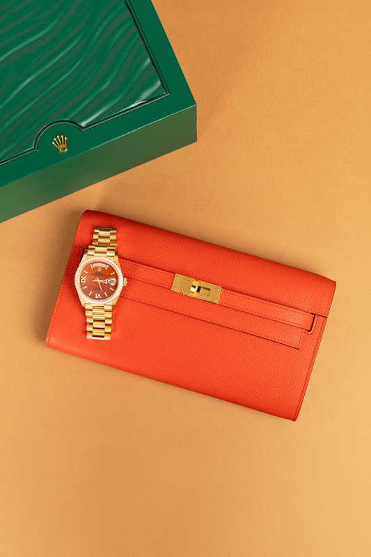 Hermès Kelly Wallet To Go Epsom in Capucine GHW & Rolex Oyster Perpetual Day-Date Orange Dial with Diamonds Watch