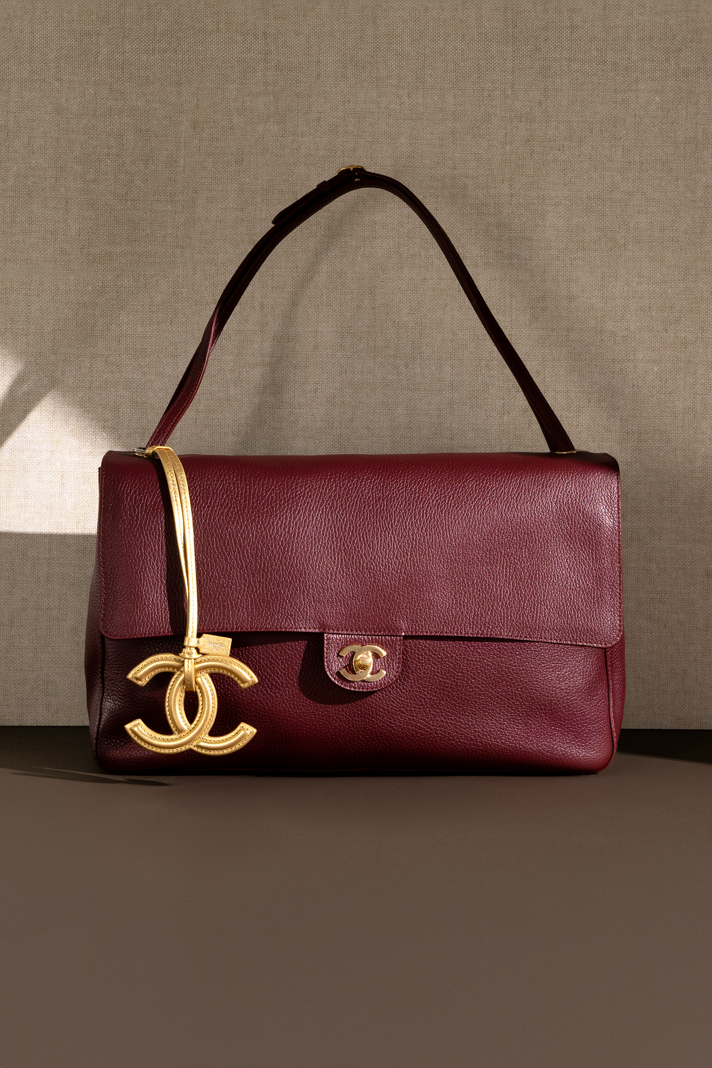 Chanel Maxi Flap Bag in Burgundy with Gold CC Charm