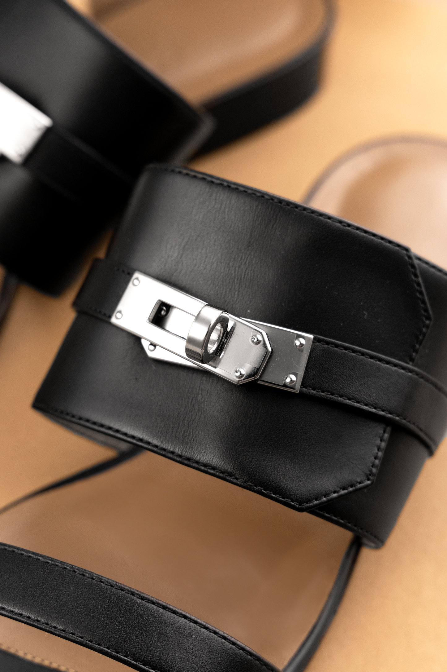 Hermès Avenue Sandals in Black PHW