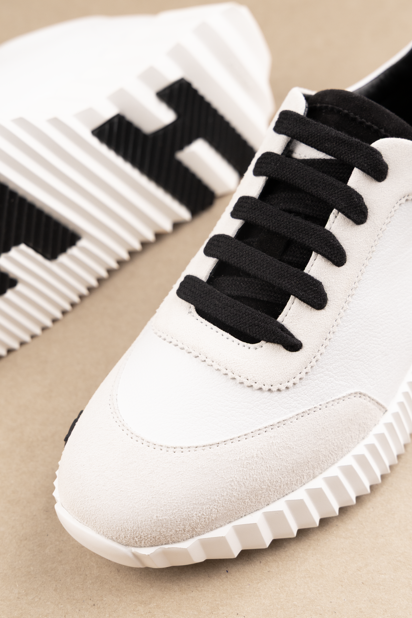 Hermès Bouncing Sneakers in White/Black H