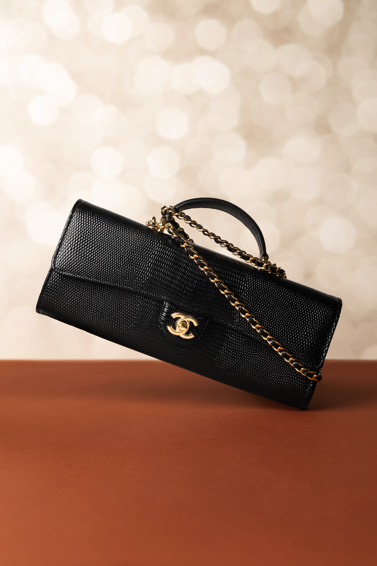 Chanel Clutch with Top Handle & Chain in Black Lizard